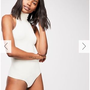 Free people white body suit in Size M/L.